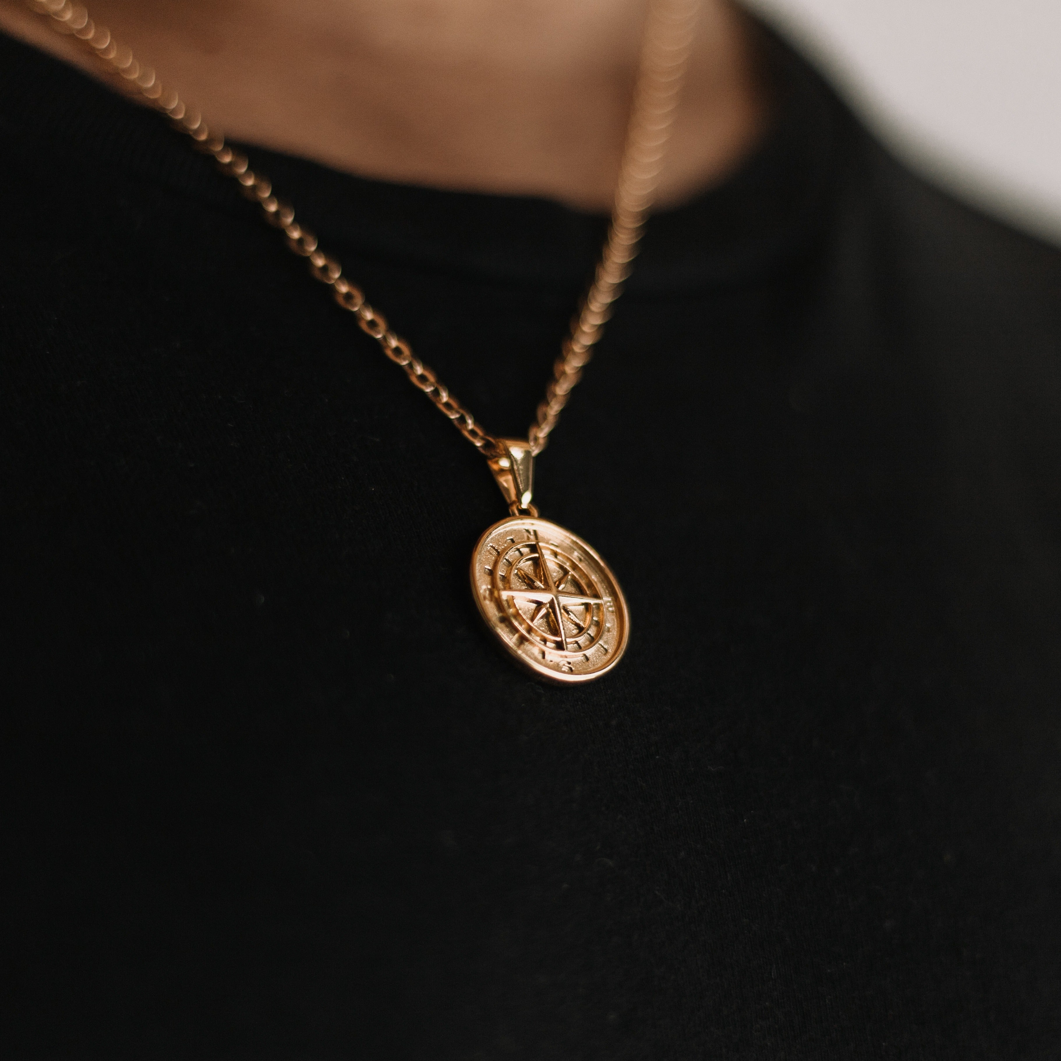 Gold compass necklace